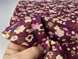 Poplin - flotte blomster på lækker lilla bund